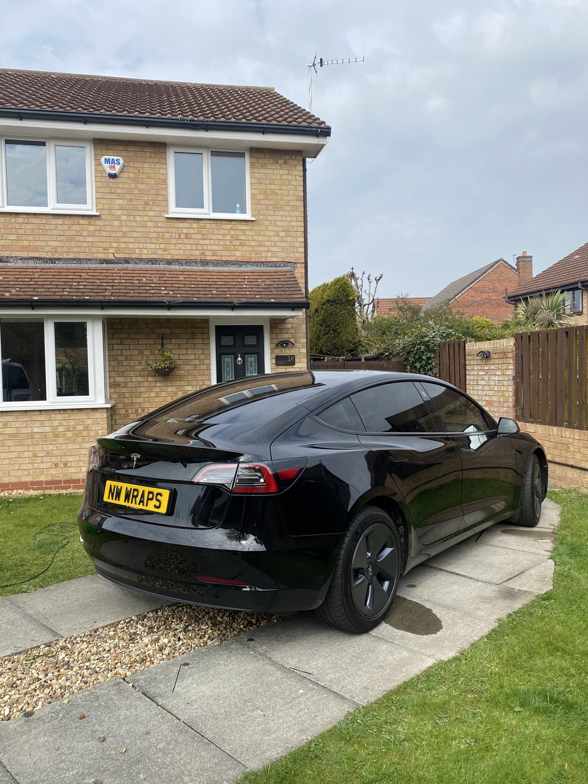 Black Tesla photographed outdoors
