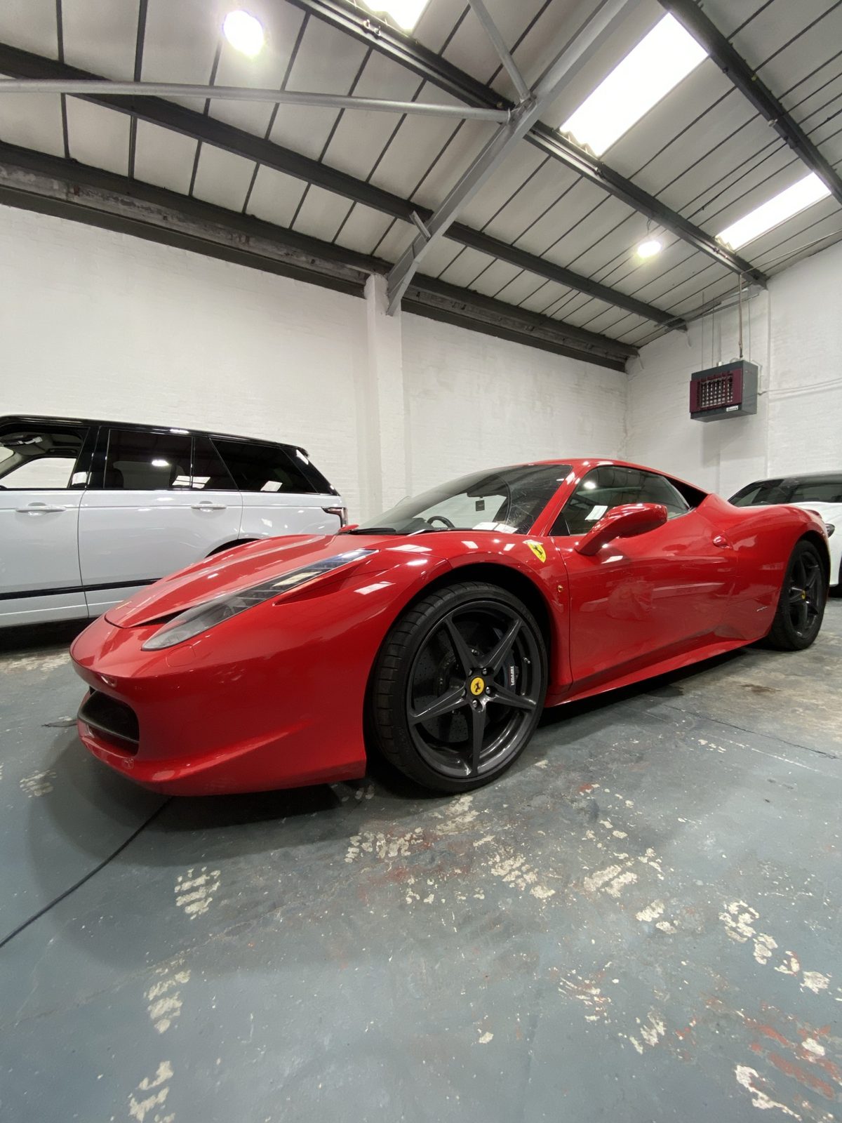 Red Ferrari in a workshop